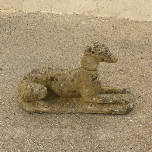 278 - Garden Statuary; A vintage reconstituted stone Dog, modelled laying on front legs, L 66cm x W 27cm x... 