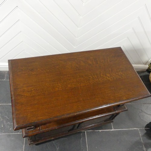 528 - A Victorian oak Monk's Bench, of typical box form, the sliding top raised on turned column supports,... 