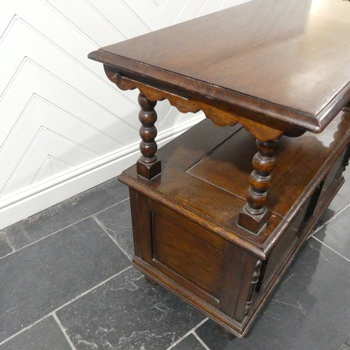 528 - A Victorian oak Monk's Bench, of typical box form, the sliding top raised on turned column supports,... 