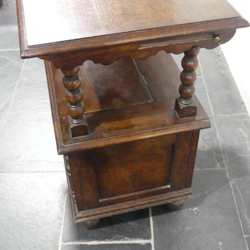 528 - A Victorian oak Monk's Bench, of typical box form, the sliding top raised on turned column supports,... 