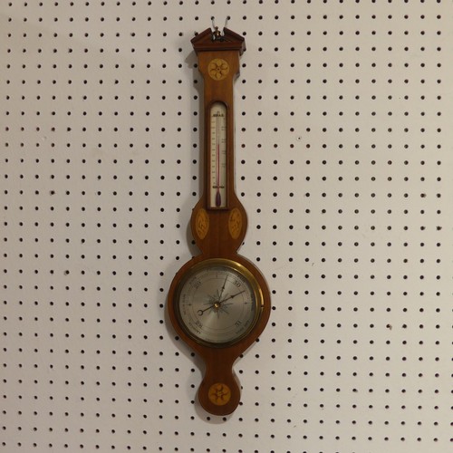 510 - An Edwardian inlaid mahogany wheel Barometer, with inlaid rosette and shell motifs, H 59cm.... 