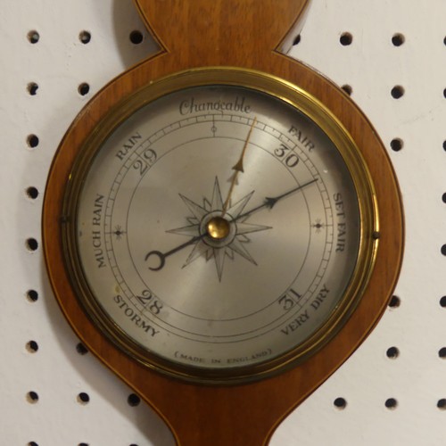 510 - An Edwardian inlaid mahogany wheel Barometer, with inlaid rosette and shell motifs, H 59cm.... 