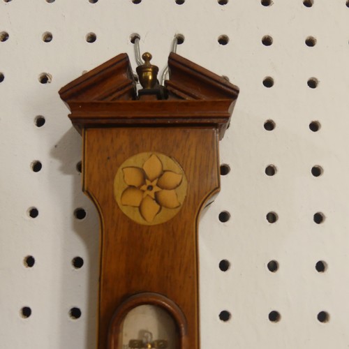 510 - An Edwardian inlaid mahogany wheel Barometer, with inlaid rosette and shell motifs, H 59cm.... 