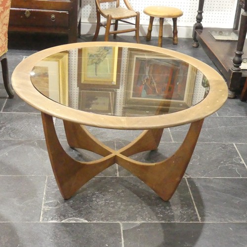 533 - A retro G-Plan Astro teak and glass topped circular Coffee Table, some fading and a few watermarks, ... 