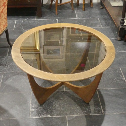 533 - A retro G-Plan Astro teak and glass topped circular Coffee Table, some fading and a few watermarks, ... 