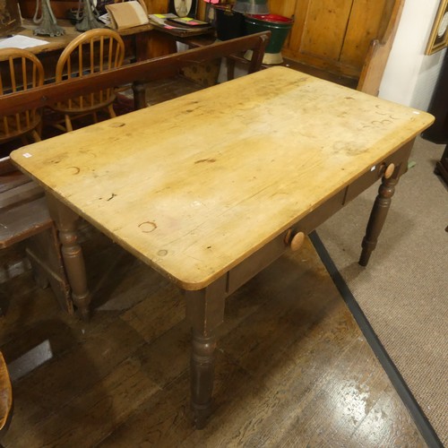 532 - A rustic pine farmhouse Kitchen Table, with two frieze drawers, all raised on turned legs, W 137cm x... 