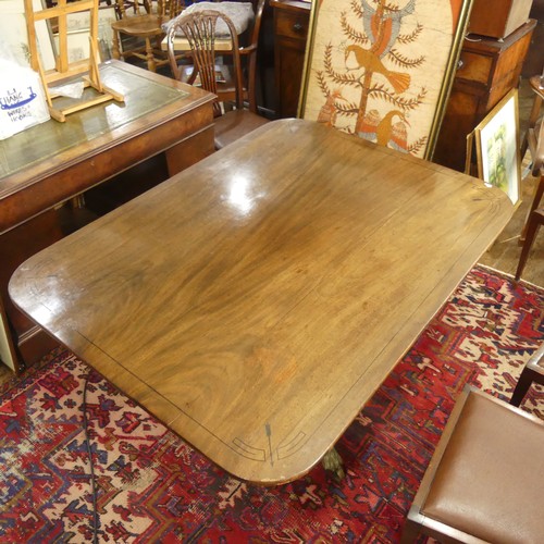 514 - A Georgian mahogany tilt-top Dining Table, the rounded rectangular top with inlaid arrows to corners... 