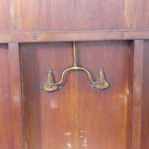 514 - A Georgian mahogany tilt-top Dining Table, the rounded rectangular top with inlaid arrows to corners... 