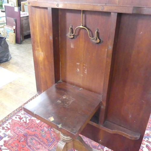 514 - A Georgian mahogany tilt-top Dining Table, the rounded rectangular top with inlaid arrows to corners... 