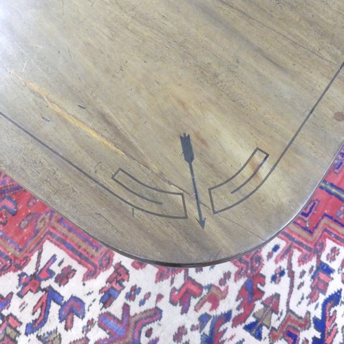 514 - A Georgian mahogany tilt-top Dining Table, the rounded rectangular top with inlaid arrows to corners... 