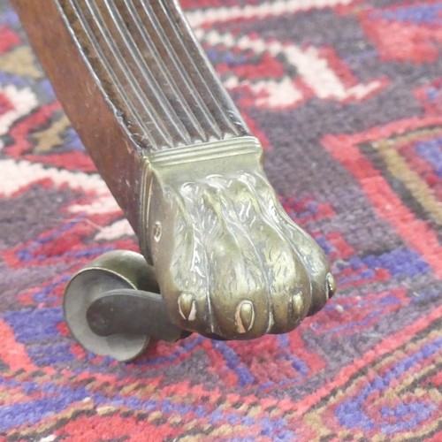 514 - A Georgian mahogany tilt-top Dining Table, the rounded rectangular top with inlaid arrows to corners... 