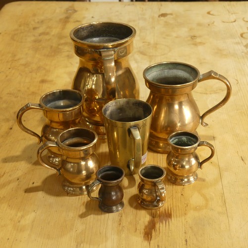 451 - A small quantity of 19thC brass Liquid Standard Measures, most stamped VR, makers including Faulker ... 