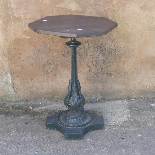 280 - Garden Statuary; An antique cast iron Garden Table, the wooden hexagonal top upon green-painted leaf... 