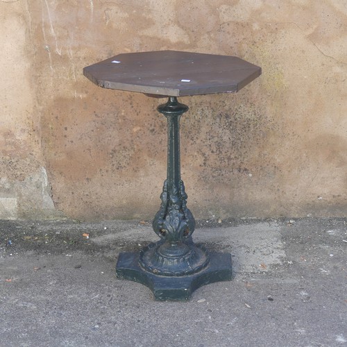 280 - Garden Statuary; An antique cast iron Garden Table, the wooden hexagonal top upon green-painted leaf... 