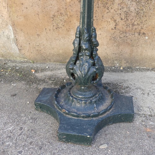 280 - Garden Statuary; An antique cast iron Garden Table, the wooden hexagonal top upon green-painted leaf... 