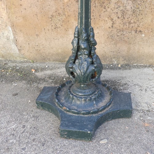 280 - Garden Statuary; An antique cast iron Garden Table, the wooden hexagonal top upon green-painted leaf... 