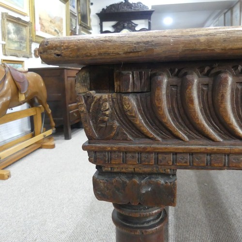 463 - An antique oak Refectory Table, the rectangular top raised above a carved frieze, all raised upon tu... 