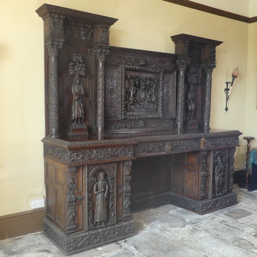 530 - A late 16thC to early 17thC, and later, heavily carved oak large inverted breakfront pedestal Sidebo... 