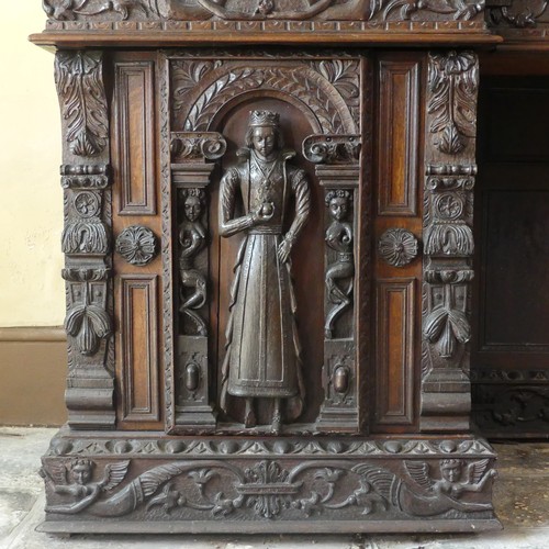 530 - A late 16thC to early 17thC, and later, heavily carved oak large inverted breakfront pedestal Sidebo... 