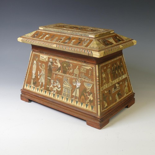 365 - An early 20thC Egyptian Revival Casket, of sarcophagus shape, with inlaid decoration, the hinged lid... 