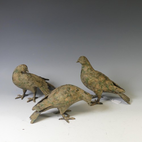 386 - A cast metal Pigeon Decoy, together with two others similar, all with remnants of gilding and green ... 