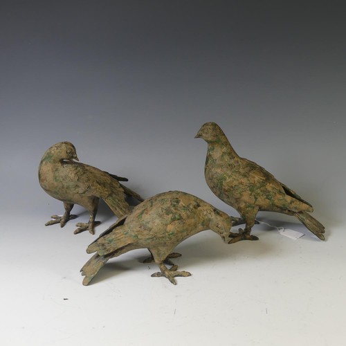 386 - A cast metal Pigeon Decoy, together with two others similar, all with remnants of gilding and green ... 