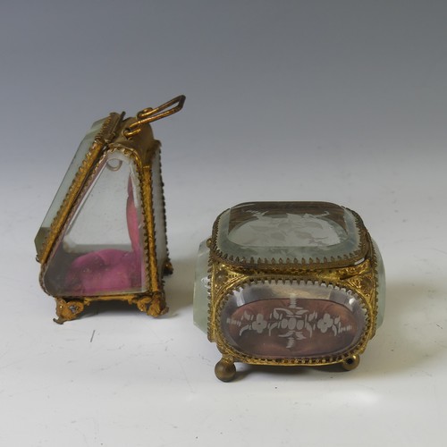 398 - A Continental Gilt-metal Jewellery Casket, having bevelled glass panels, decorated with engraved sty... 