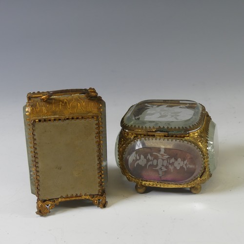 398 - A Continental Gilt-metal Jewellery Casket, having bevelled glass panels, decorated with engraved sty... 