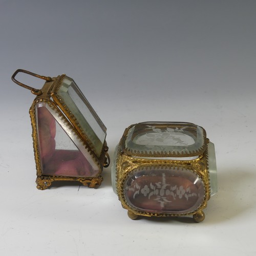 398 - A Continental Gilt-metal Jewellery Casket, having bevelled glass panels, decorated with engraved sty... 