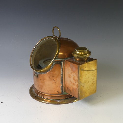 429 - An antique copper and brass cased Ship's Binnacle, with circular glass viewing panel and with lamp b... 