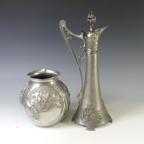 443 - An Art Nouveau style pewter lidded Jug, with shaped handle and decorated with busts of ladies,  rais... 