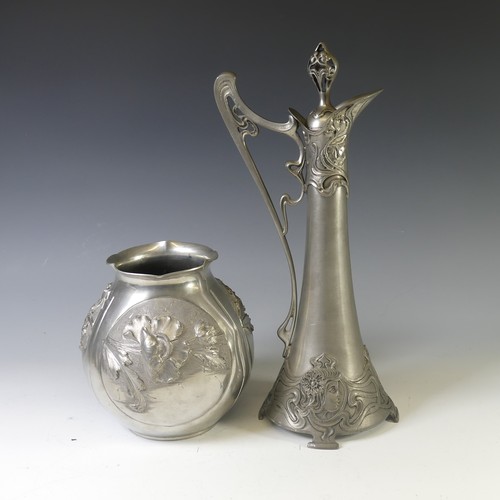 443 - An Art Nouveau style pewter lidded Jug, with shaped handle and decorated with busts of ladies,  rais... 