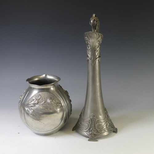 443 - An Art Nouveau style pewter lidded Jug, with shaped handle and decorated with busts of ladies,  rais... 