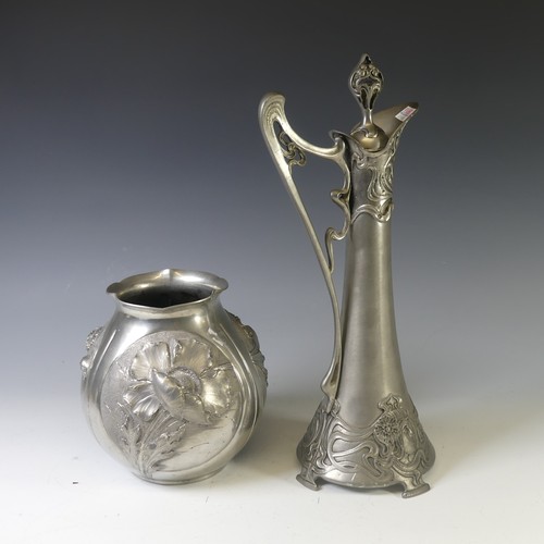 443 - An Art Nouveau style pewter lidded Jug, with shaped handle and decorated with busts of ladies,  rais... 