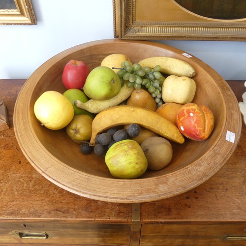 554 - An antique treen turned wood Fruit Bowl, 45cm diameter, together with a quantity of ornamental fruit... 