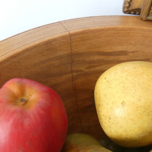 554 - An antique treen turned wood Fruit Bowl, 45cm diameter, together with a quantity of ornamental fruit... 