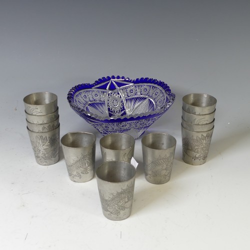 124 - A set of twelve 20thC Chinese pewter shot beakers, each decorated with scrolling dragons, stamped 'K... 