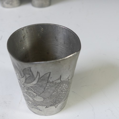 124 - A set of twelve 20thC Chinese pewter shot beakers, each decorated with scrolling dragons, stamped 'K... 