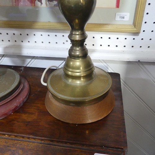 497 -  A pair of heavy Oriental turned brass Table Lamps, with bobbin turned shafts, drip trays and circul... 