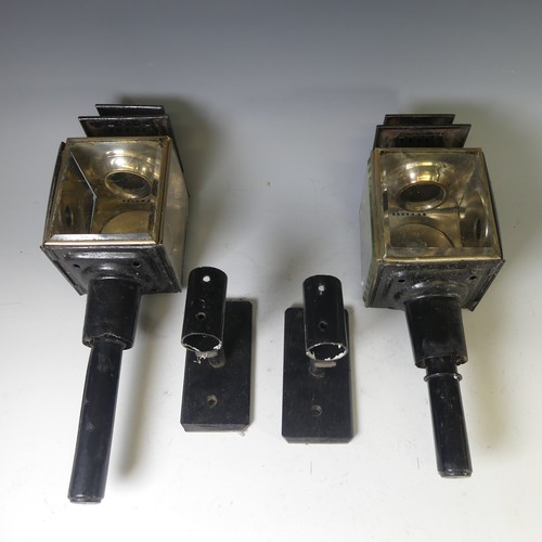 558 - A pair of black painted Coach Lamps, with bevelled glass and holders, H 45cm, broken glass, together... 