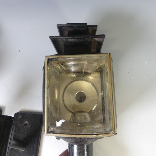 558 - A pair of black painted Coach Lamps, with bevelled glass and holders, H 45cm, broken glass, together... 