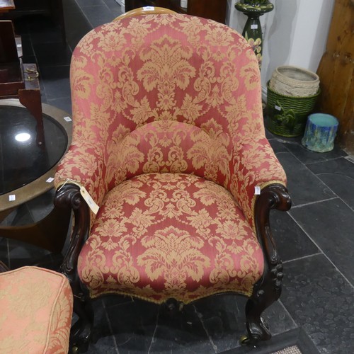 550 - A Victorian carved show-frame upholstered Armchair, with floral upholstery, on carved front legs and... 