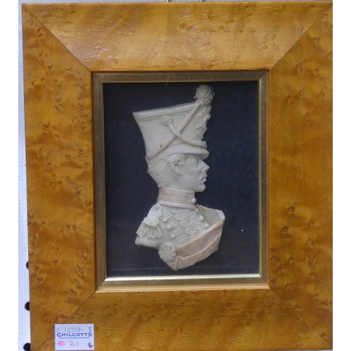 500 - A wax portrait of a 19thC Gentleman, in glazed papier-mache frame, overall frame dimension 16cm x 18... 