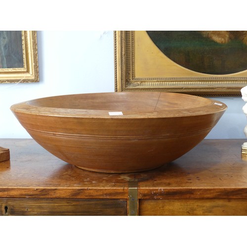 554 - An antique treen turned wood Fruit Bowl, 45cm diameter, together with a quantity of ornamental fruit... 