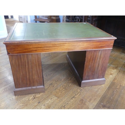 531 - An Edwardian twin Pedestal desk, the rectangular top inset with tooled green skiver, above three fri... 