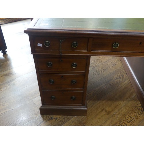 531 - An Edwardian twin Pedestal desk, the rectangular top inset with tooled green skiver, above three fri... 