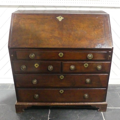 508 - A George III mahogany Bureau, the fall front with engraved escutcheon opening to reveal a fitted int... 