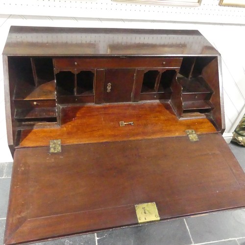 508 - A George III mahogany Bureau, the fall front with engraved escutcheon opening to reveal a fitted int... 