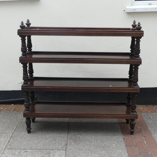 526 - A 19th century Anglo-Indian carved hardwood four-tier Whatnot, with turned and carved supports, and ... 