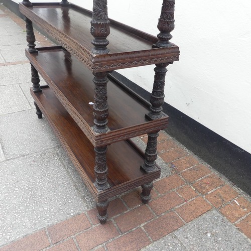 526 - A 19th century Anglo-Indian carved hardwood four-tier Whatnot, with turned and carved supports, and ... 